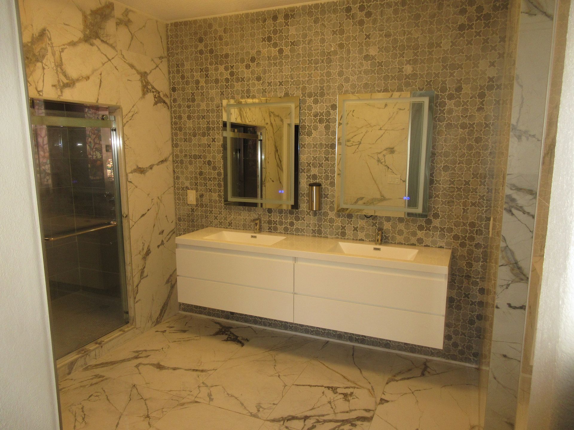 A bathroom with two sinks and two mirrors.