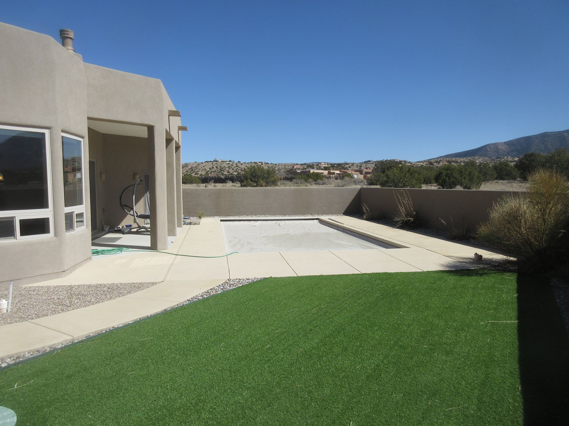 Outside view of the front yard of a rental property in Placitas, NM with Advantage Pointe Properties that is 3BDR/2BA/3CG