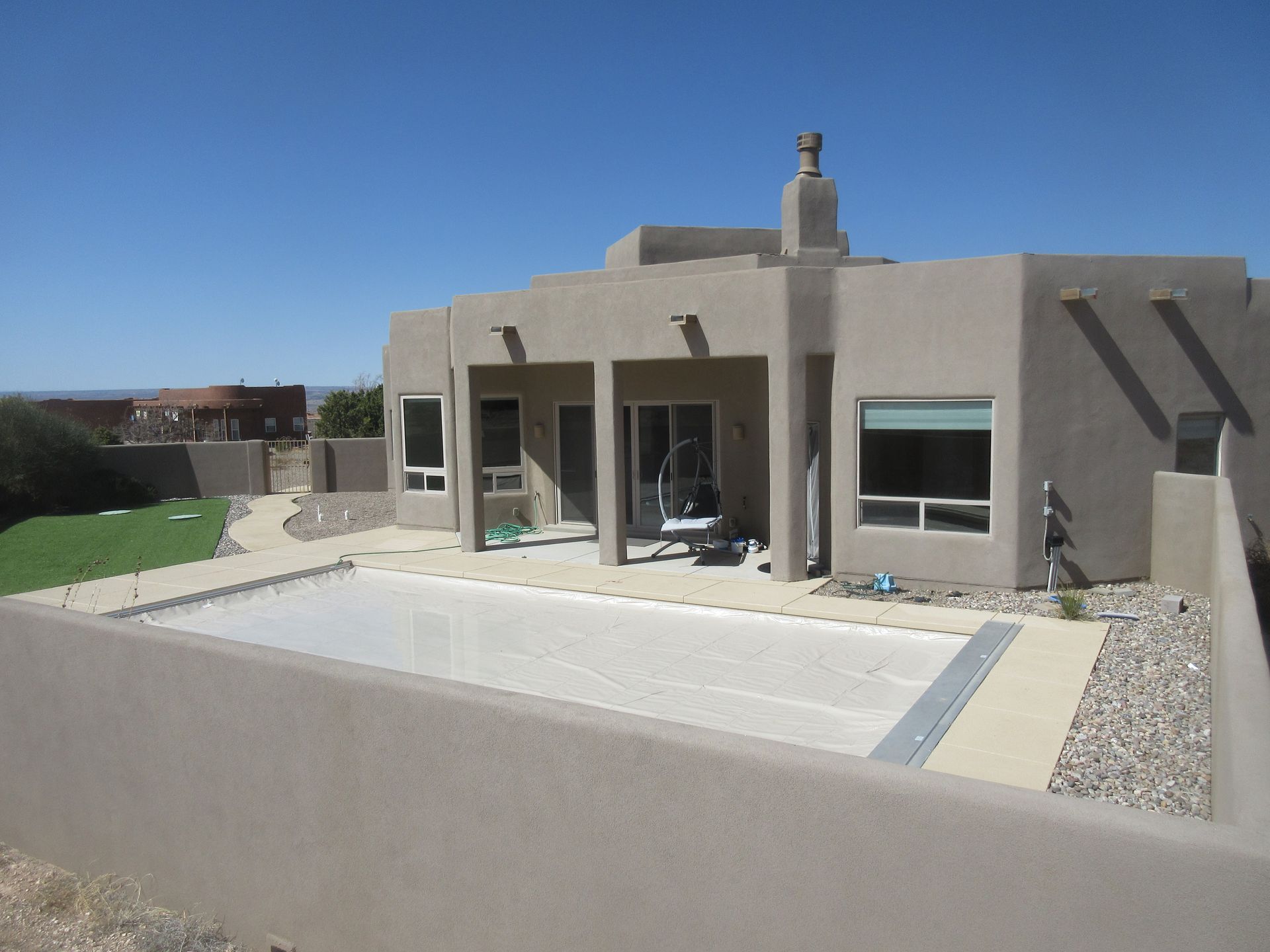 Outside view of the pool at a rental property in Placitas, NM with Advantage Pointe Properties that is 3BDR/2BA/3CG