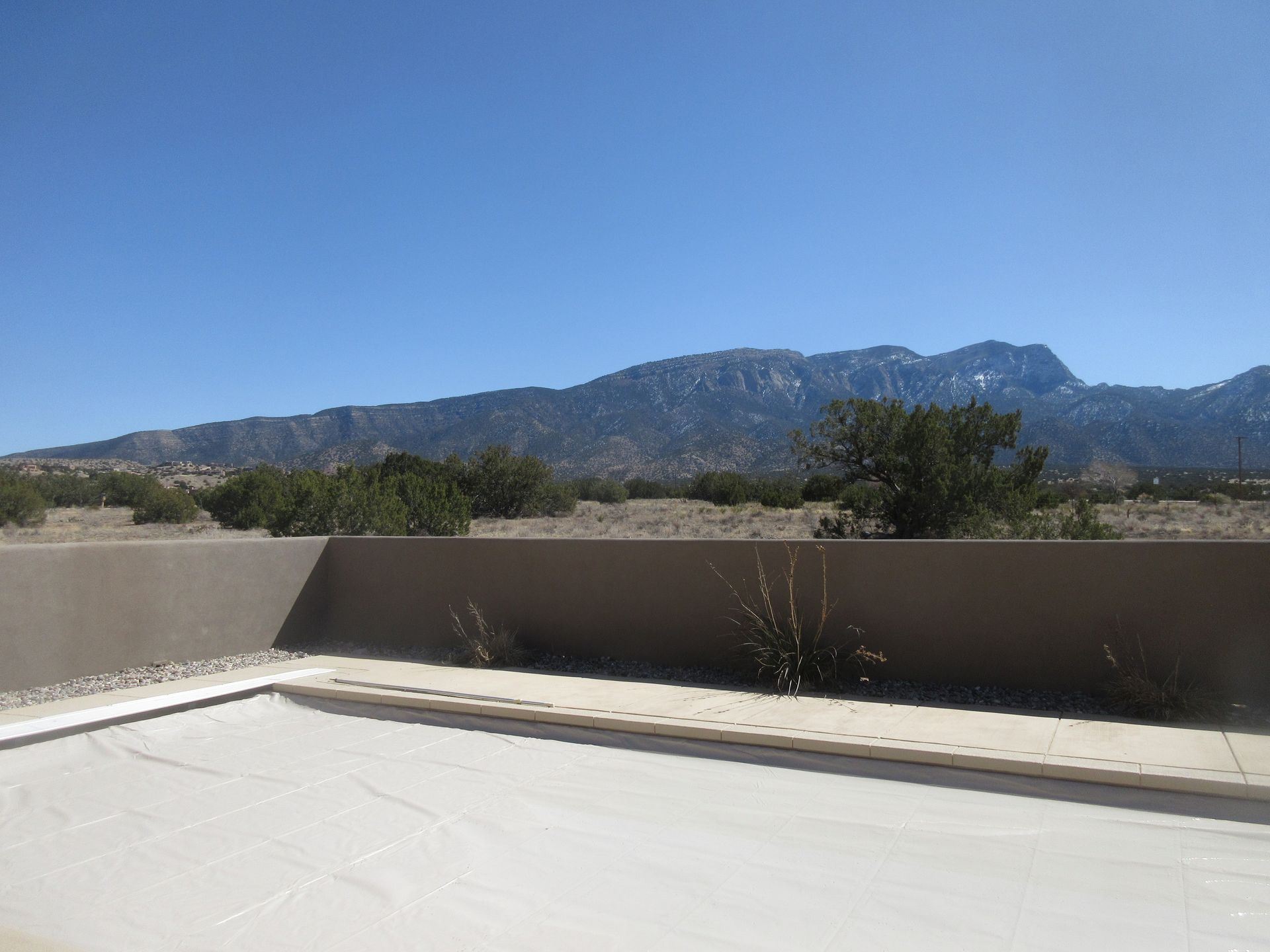 Backyard view of Sandia Mountains at a rental property in Placitas, NM with Advantage Pointe Properties that is 3BDR/2BA/3CG