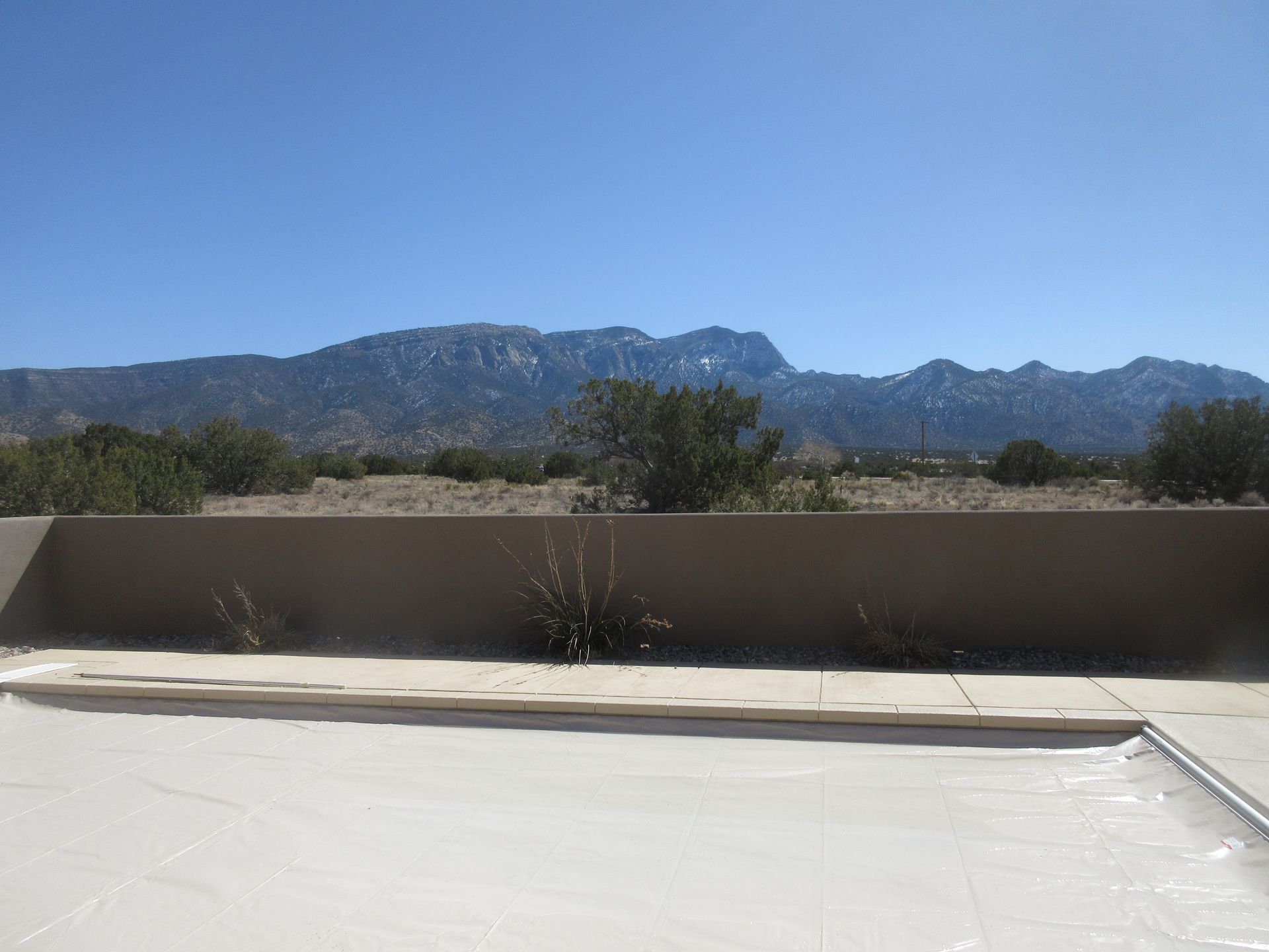 Backyard view of Sandia Mountains at a rental property in Placitas, NM with Advantage Pointe Properties that is 3BDR/2BA/3CG