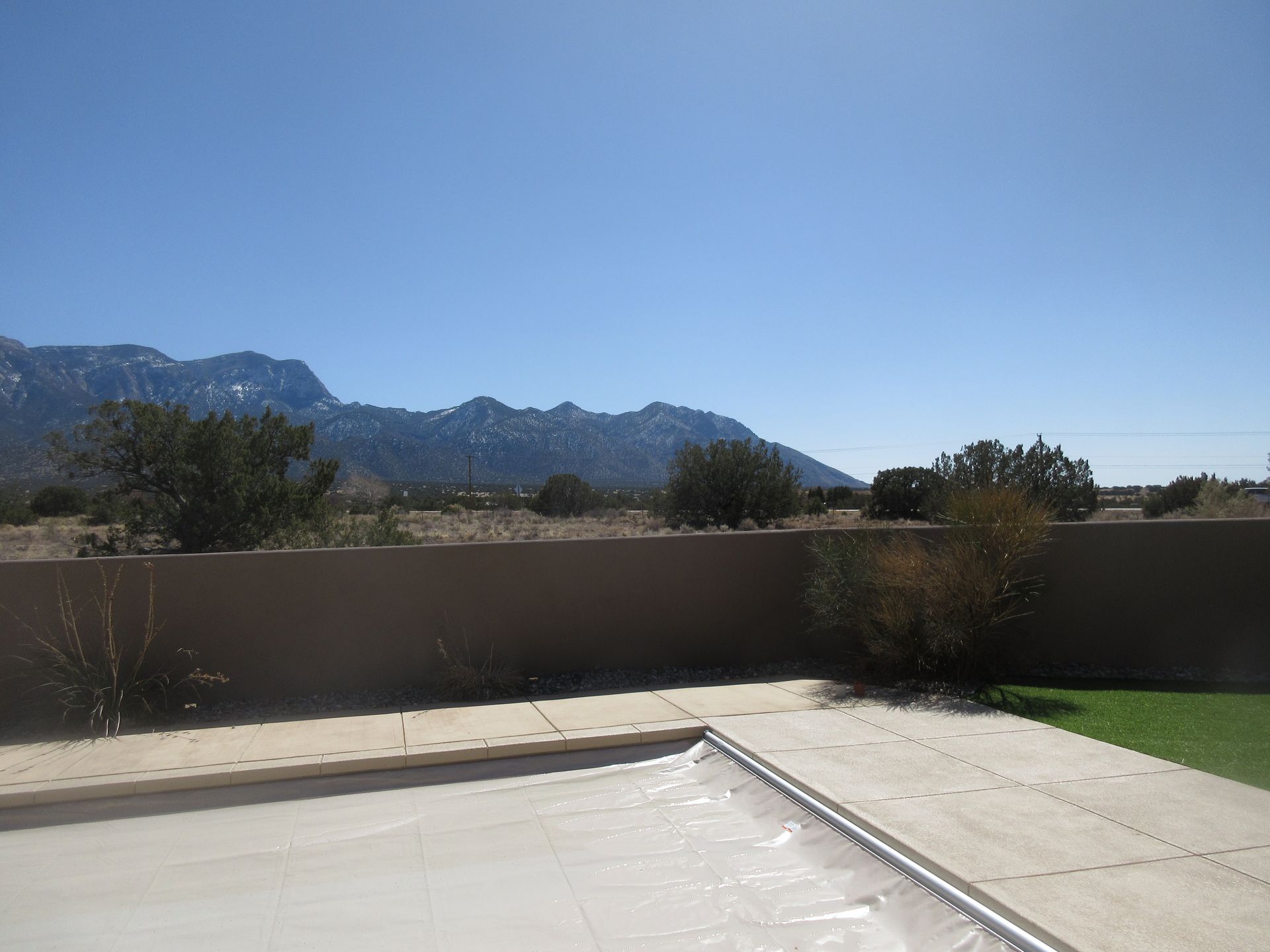 Backyard view of Sandia Mountains at a rental property in Placitas, NM with Advantage Pointe Properties that is 3BDR/2BA/3CG