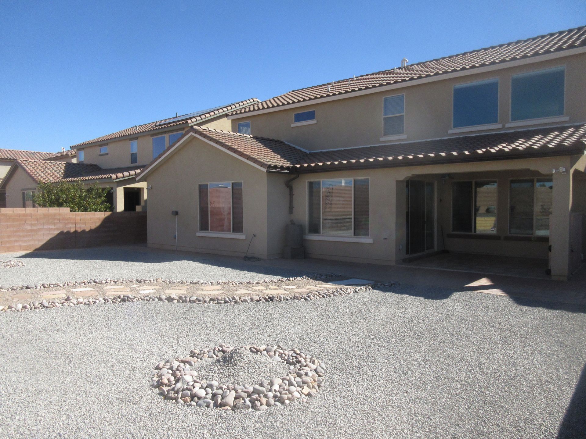 A house with a fire pit in front of it