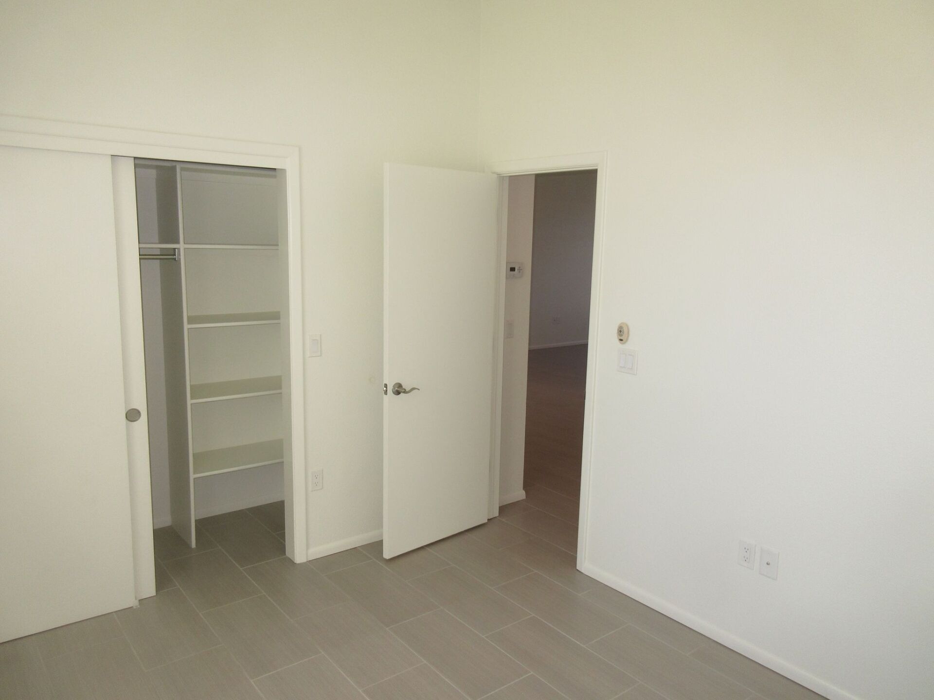 There is a closet in the middle of the room.