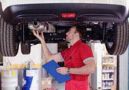 Mechanic Inspecting a Car — Bro Muffler & Auto Repair in Huntington Beach, CA