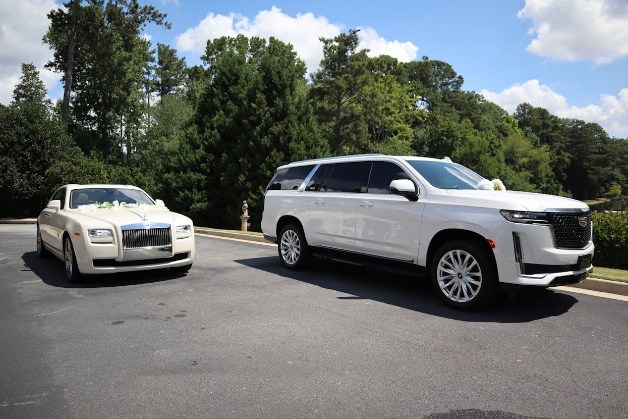 White Rolls Royce Ghost and white Cadillac Escalade with wedding decor for luxury wedding transportation in Atlanta
