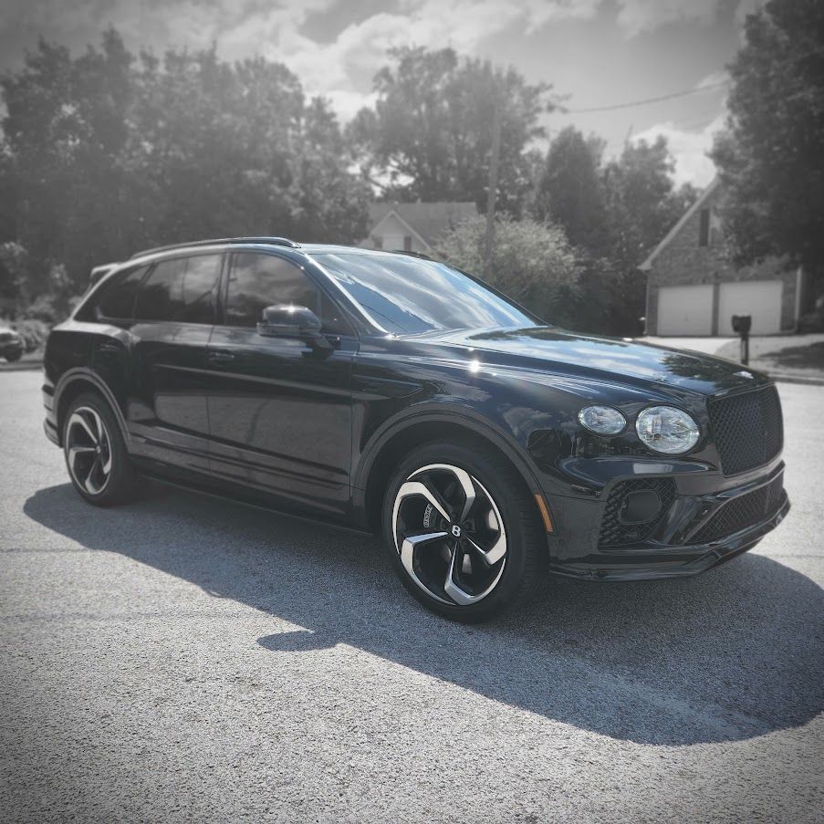 Black Bentley Bentayga luxury SUV private car service with concierge drivers in Atlanta
