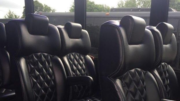 Premium coach bus interior for VIP group transportation and airport transfers in Atlanta

