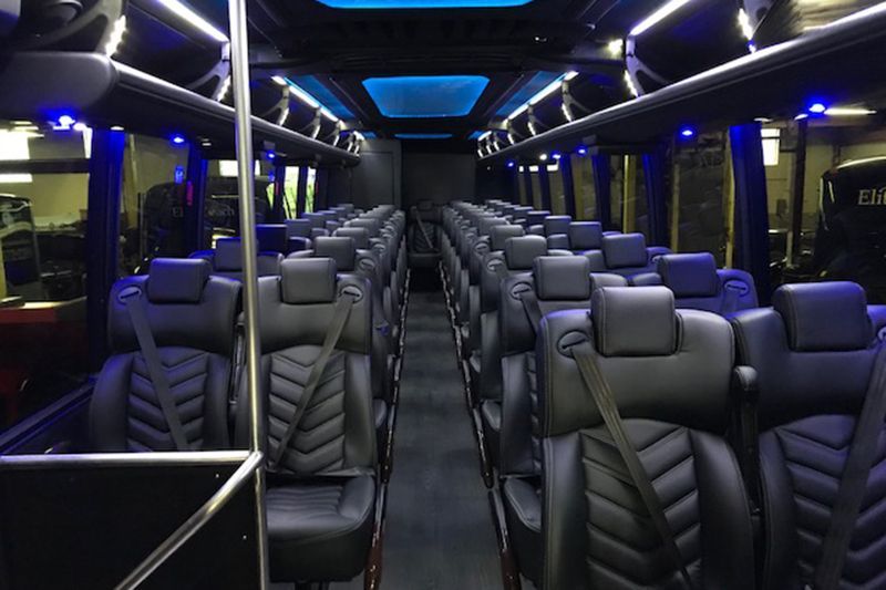 Atlanta luxury transportation featuring coach bus interior for large group travel
