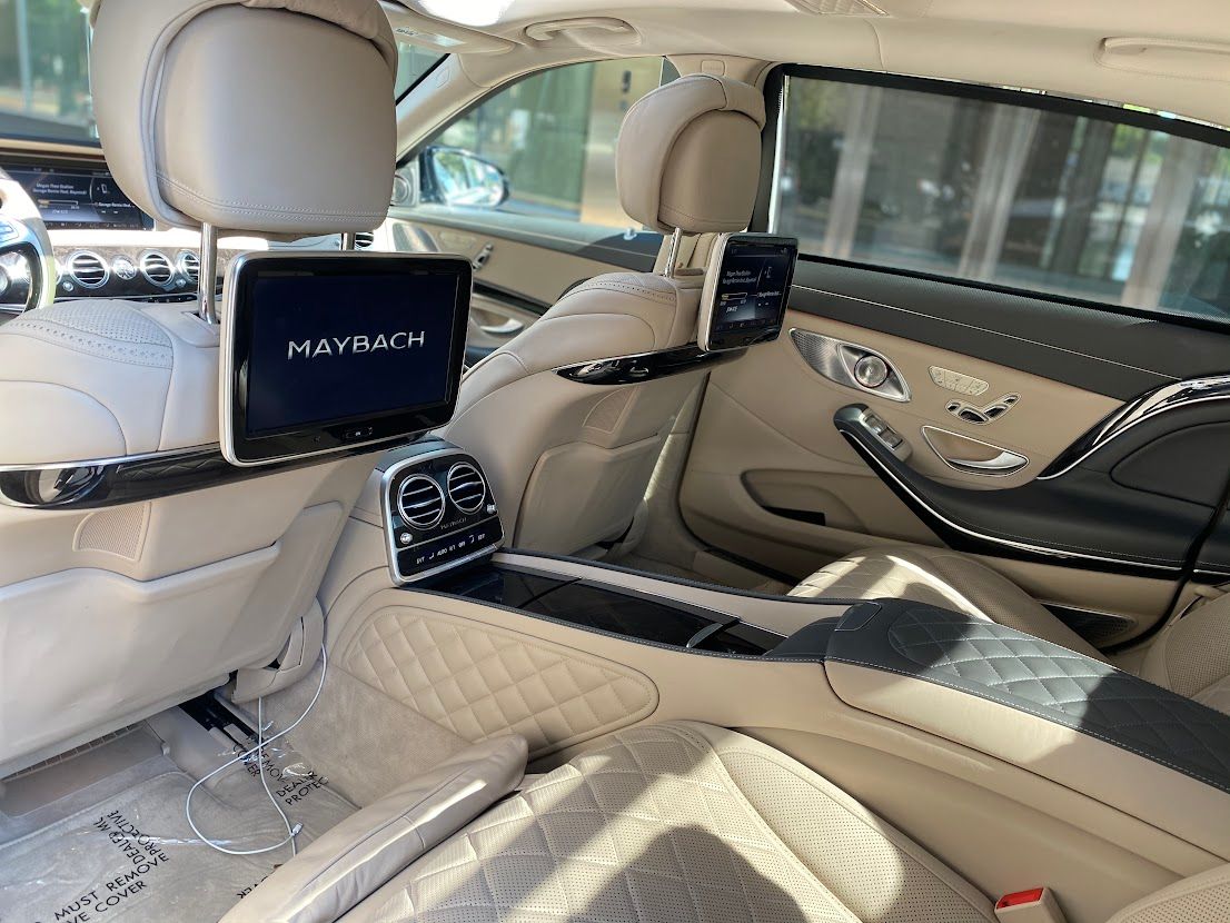 Atlanta exotic transportation featuring cream Maybach interior with VIP personal driver
