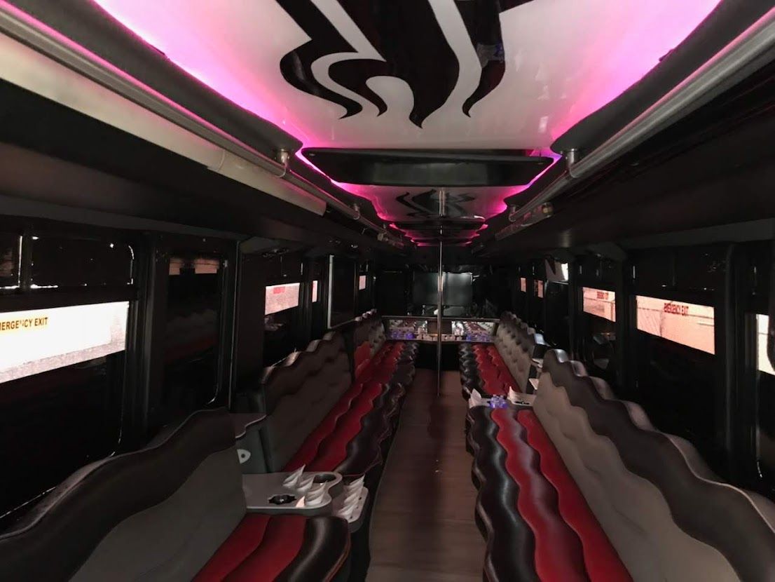 Luxury party bus interior with LED lighting for nightlife transportation in Atlanta
