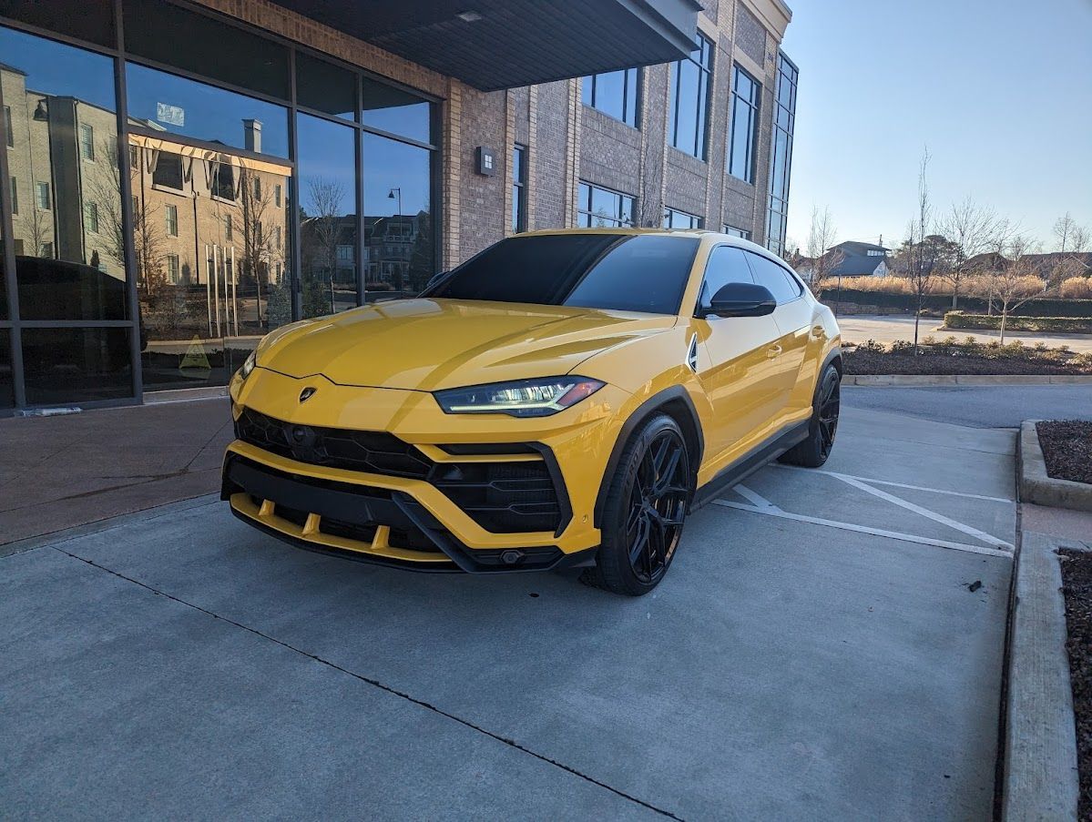 Atlanta exotic transportation featuring yellow Lamborghini Urus with private car service
