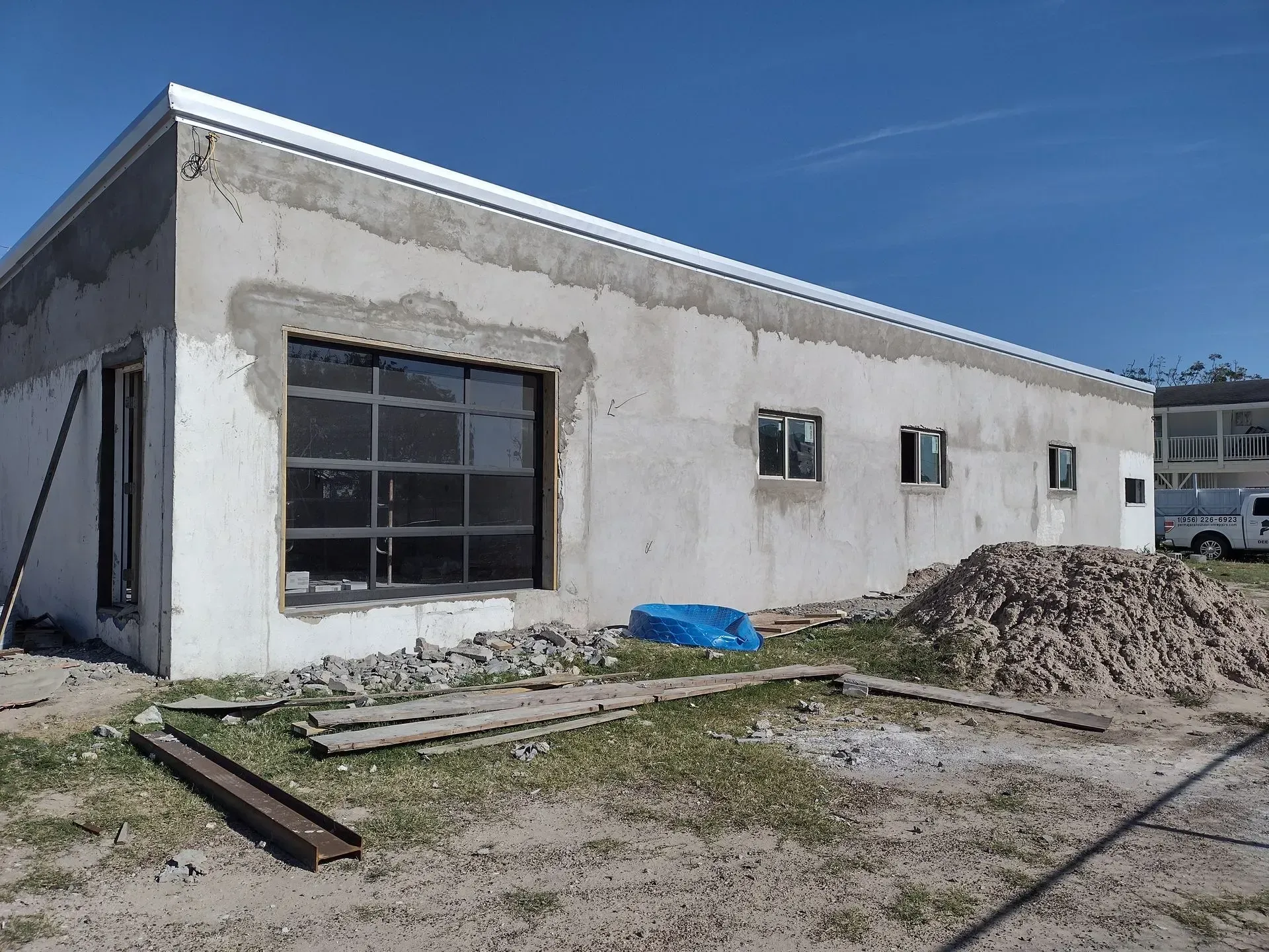 a building that is being built with a lot of windows