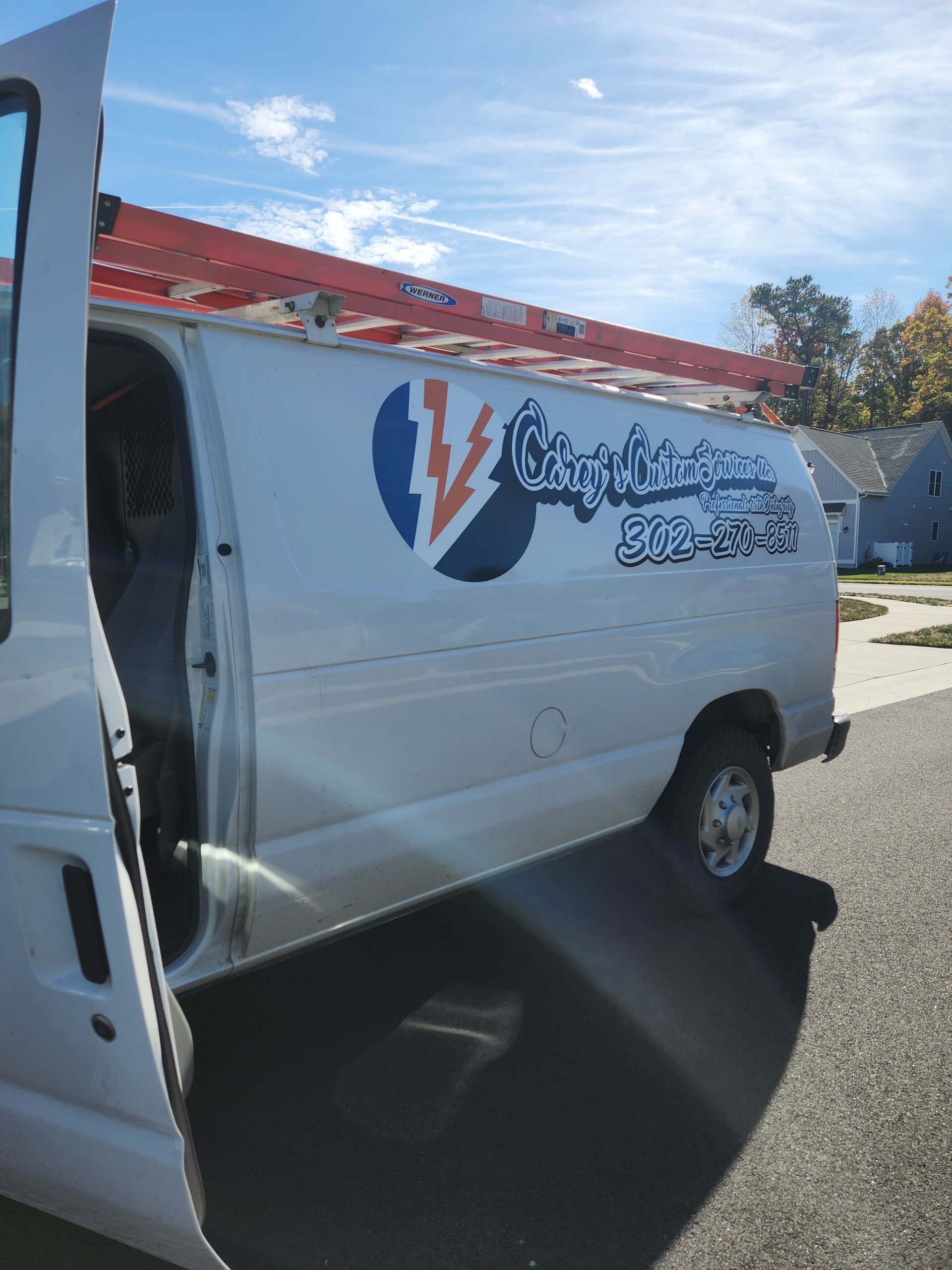 A close up of a light bulb hanging from a ceiling