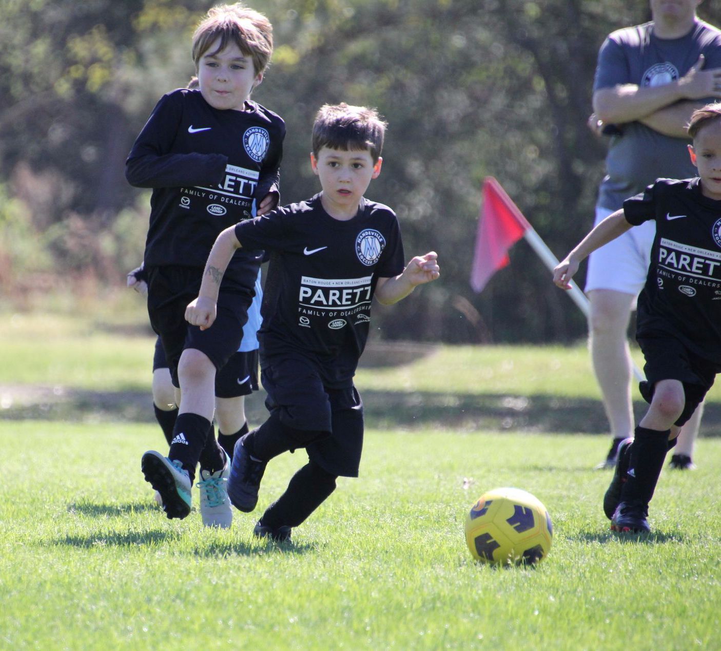 Young boys playing recreational soccer for Mandeville Soccer Club