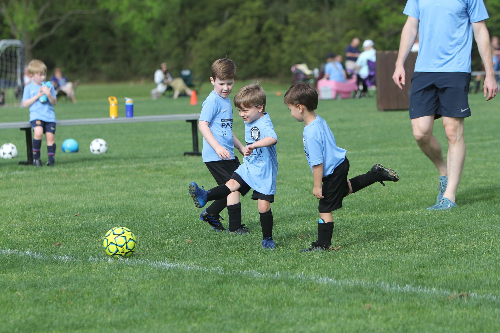 Young children playing recreational soccer for Mandeville Soccer Club