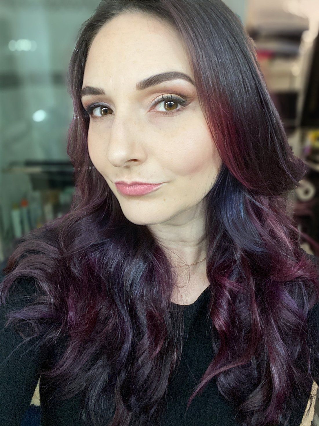 woman with long dark wavy hair