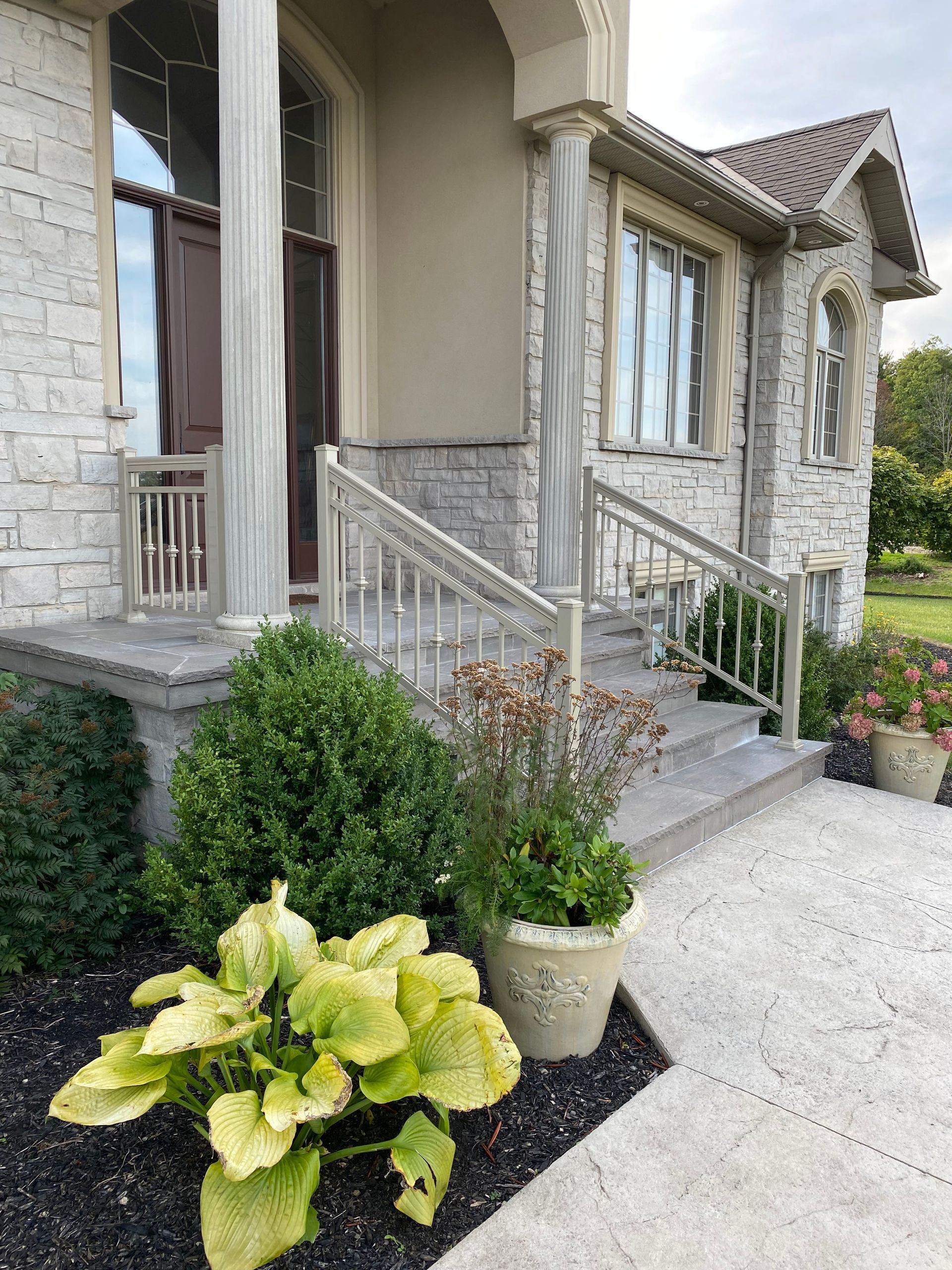 A porch is adorned by stunning porch columns.