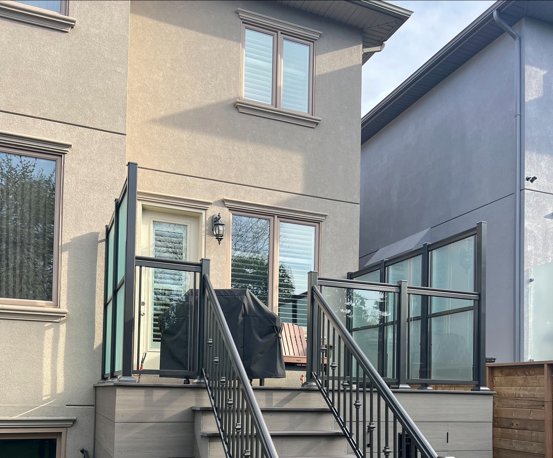The back of a house with stairs leading up to it