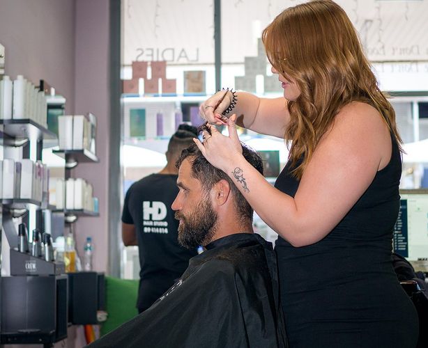 Woman Cutting Man's Hair in a Salon — HD Hair Studio in Darwin City, NT