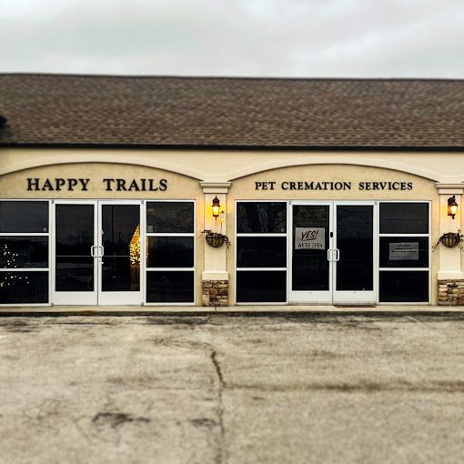 The front of a building called happy trails pet cremation services.