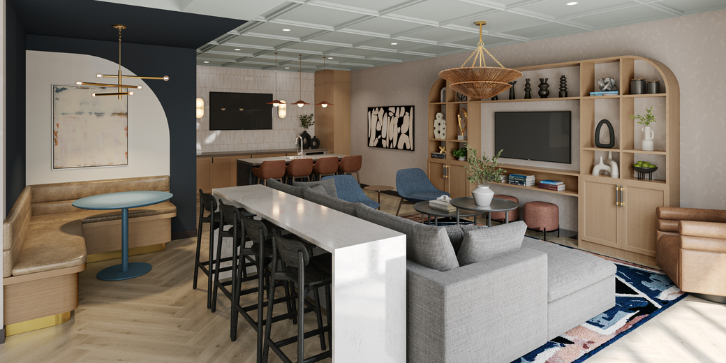 A clubhouse with a couch , table , chairs and a television.