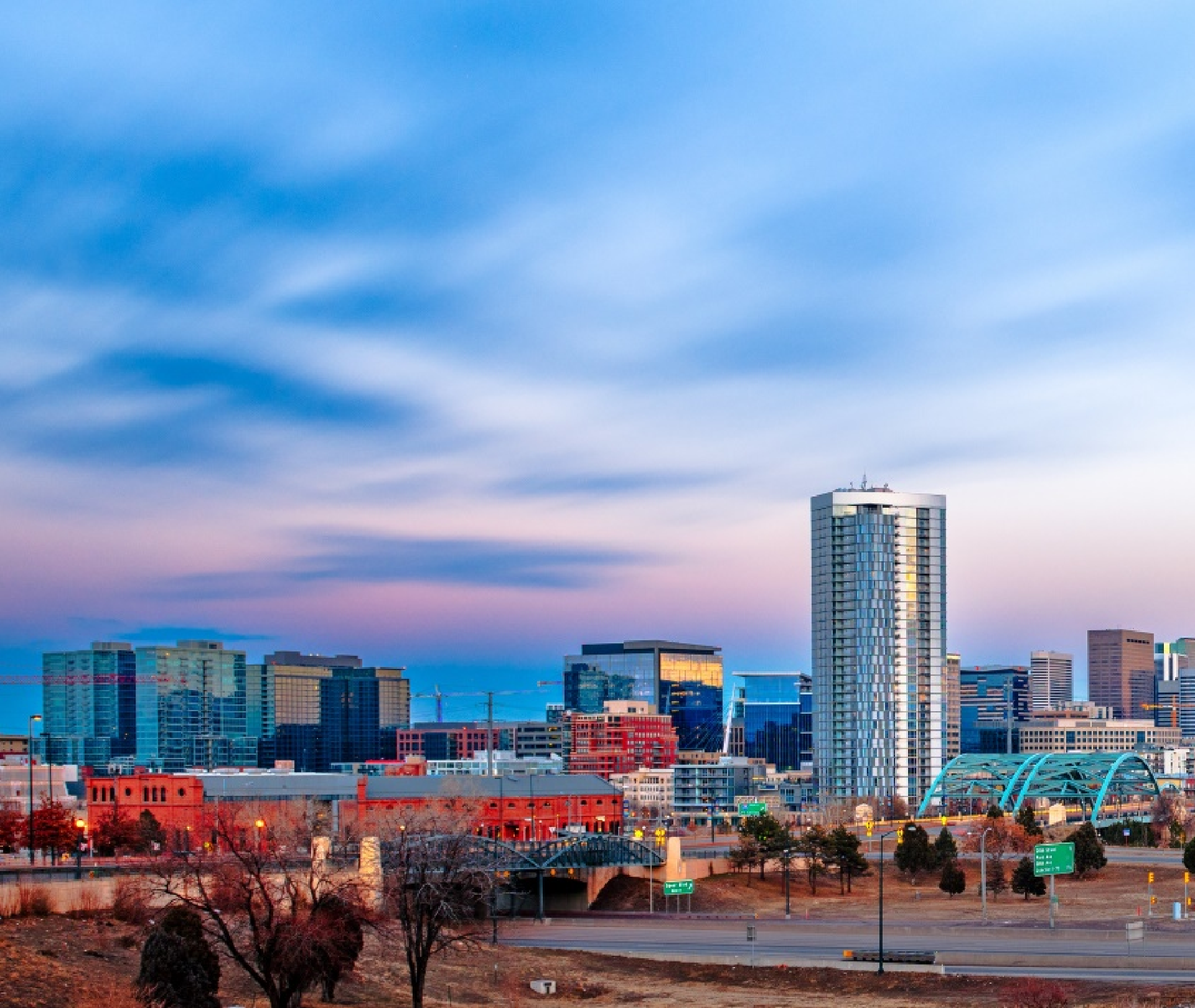 A city skyline with a bridge in the foreground