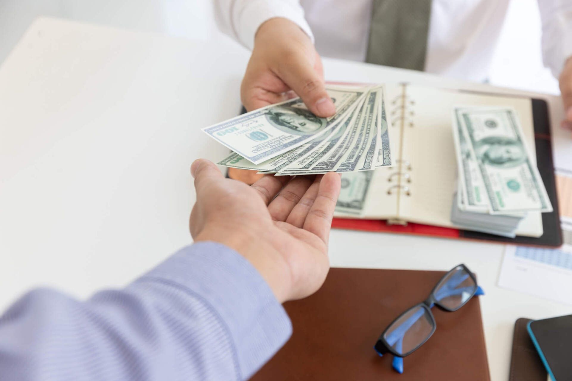 Businessman Giving Money — Metairie, LA — Clement Donelon, Attorney At Law