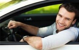 Smiling guy inside the car — Insurance Agents in South New Jersey
