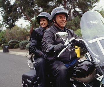 Happy couple riding — Insurance Agents in South New Jersey