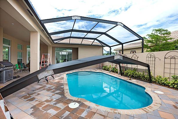 A large swimming pool with a canopy over it.