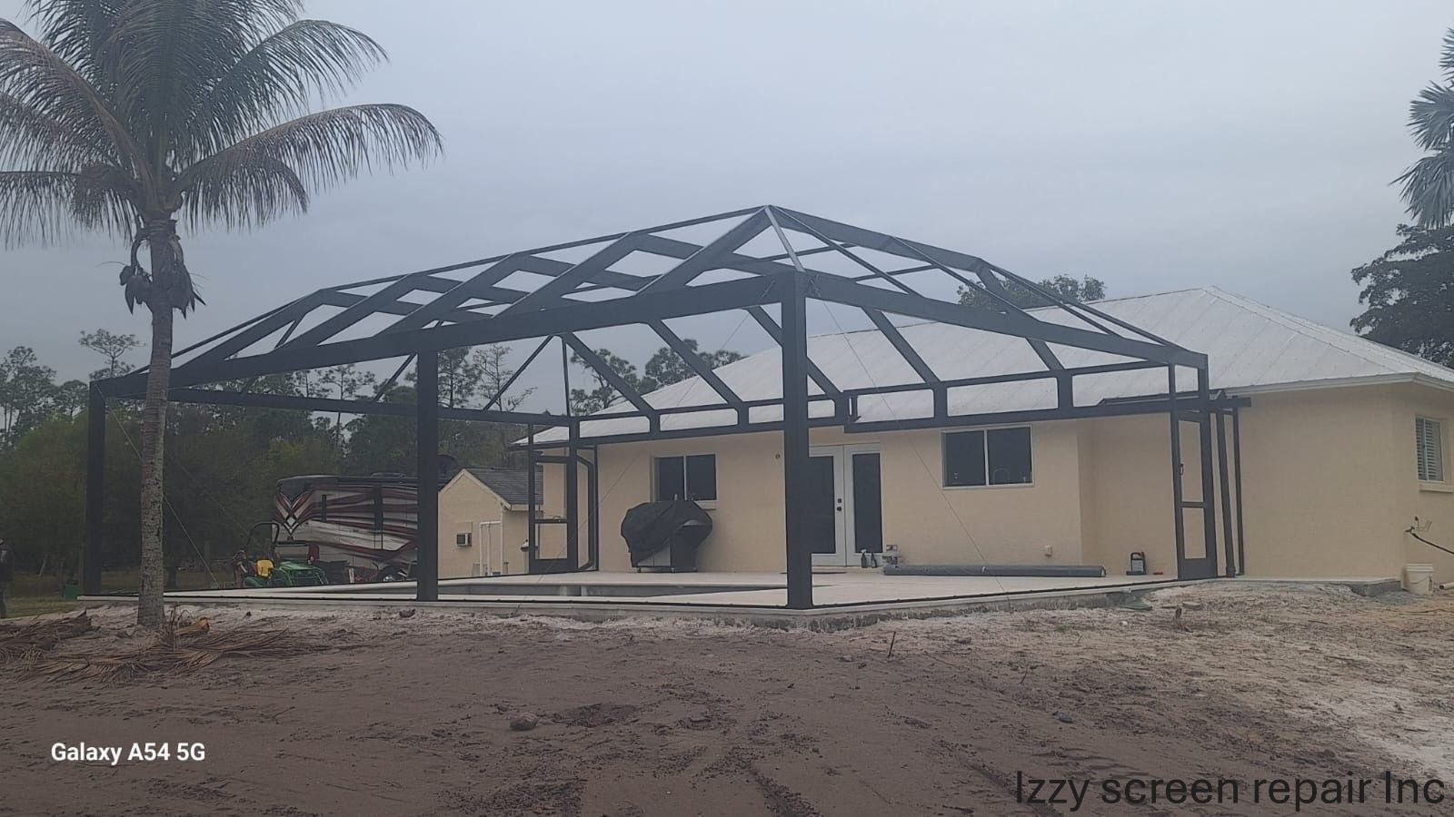 A picture of a house with a canopy on top of it