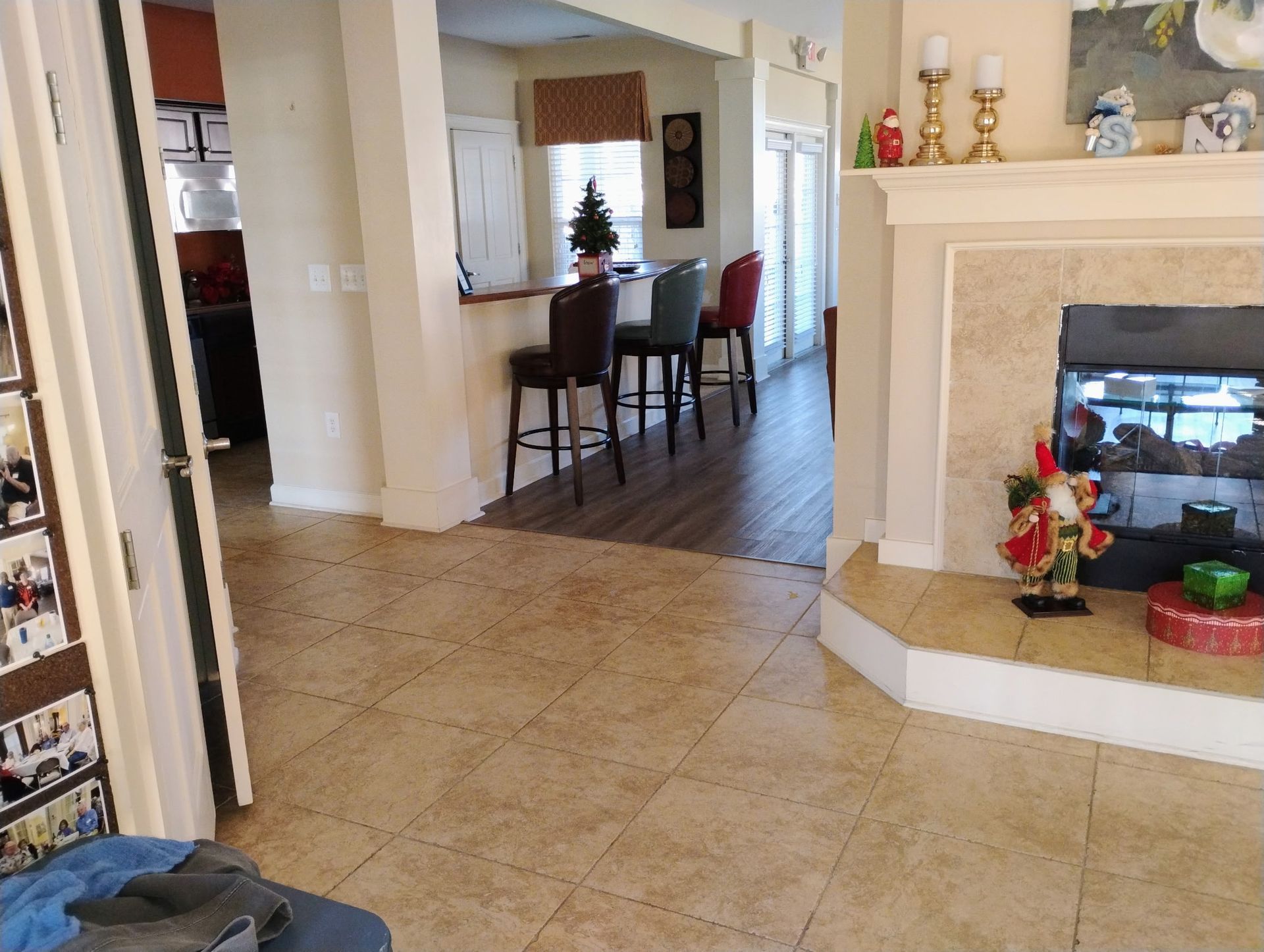 A group of people are cleaning a living room.