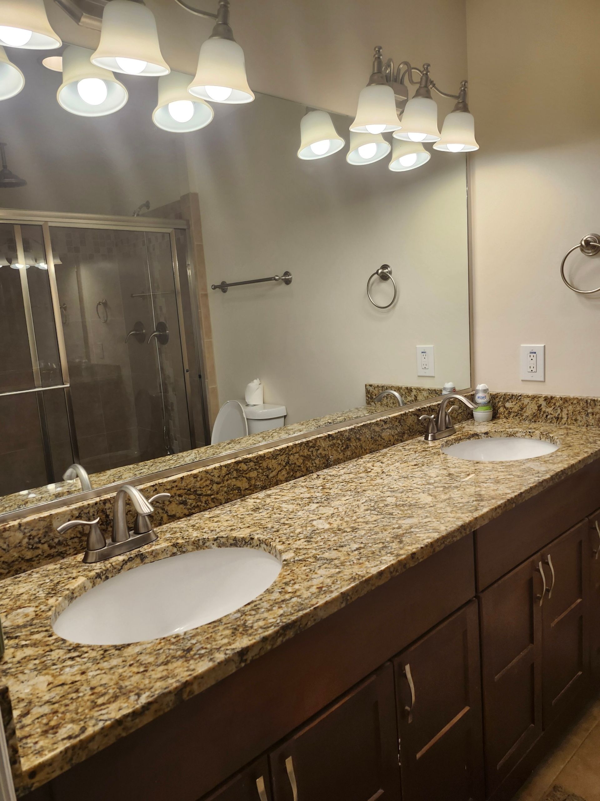A man is cleaning a window with a squeegee.