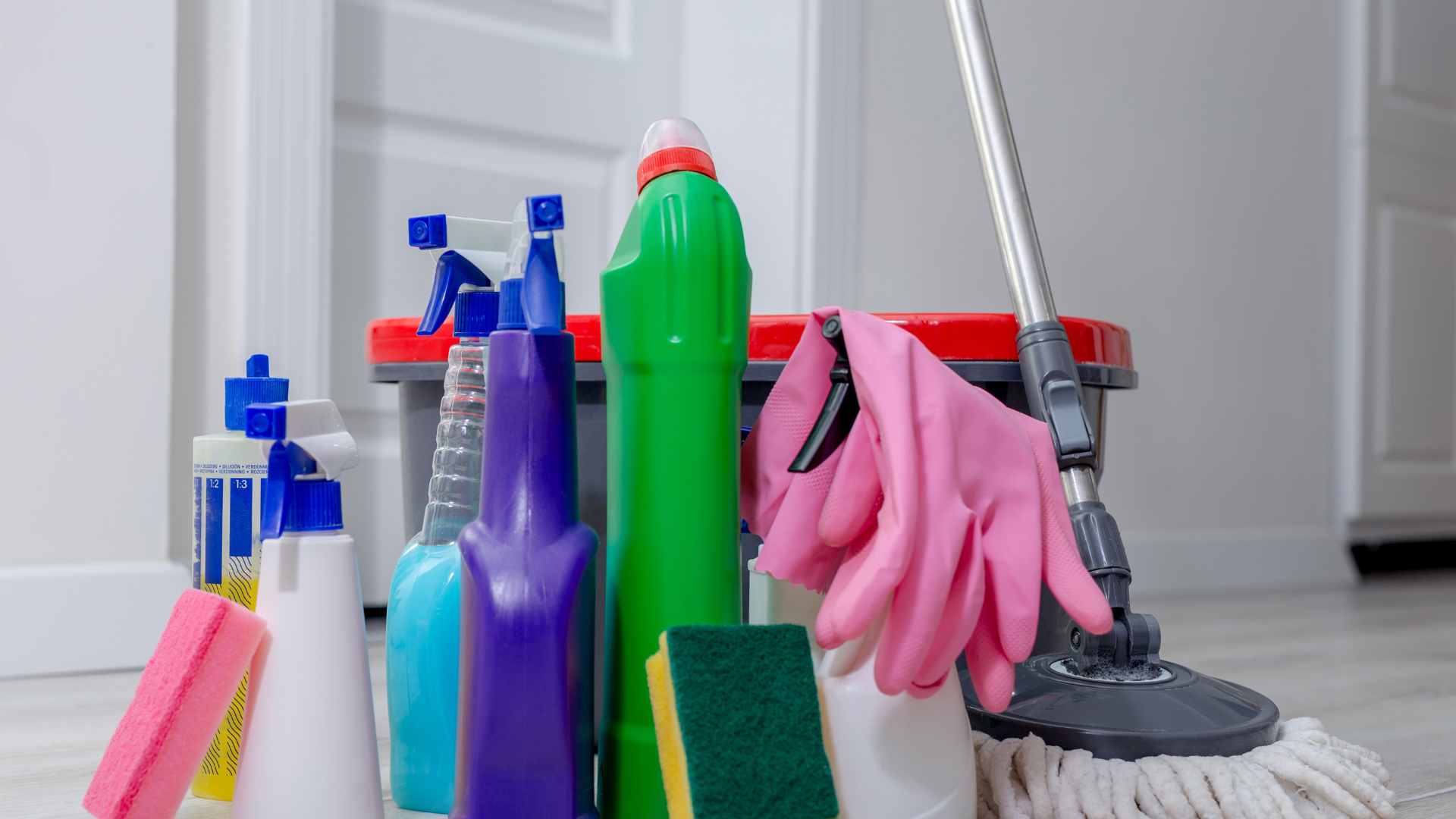 A group of cleaners are cleaning a floor in an office.