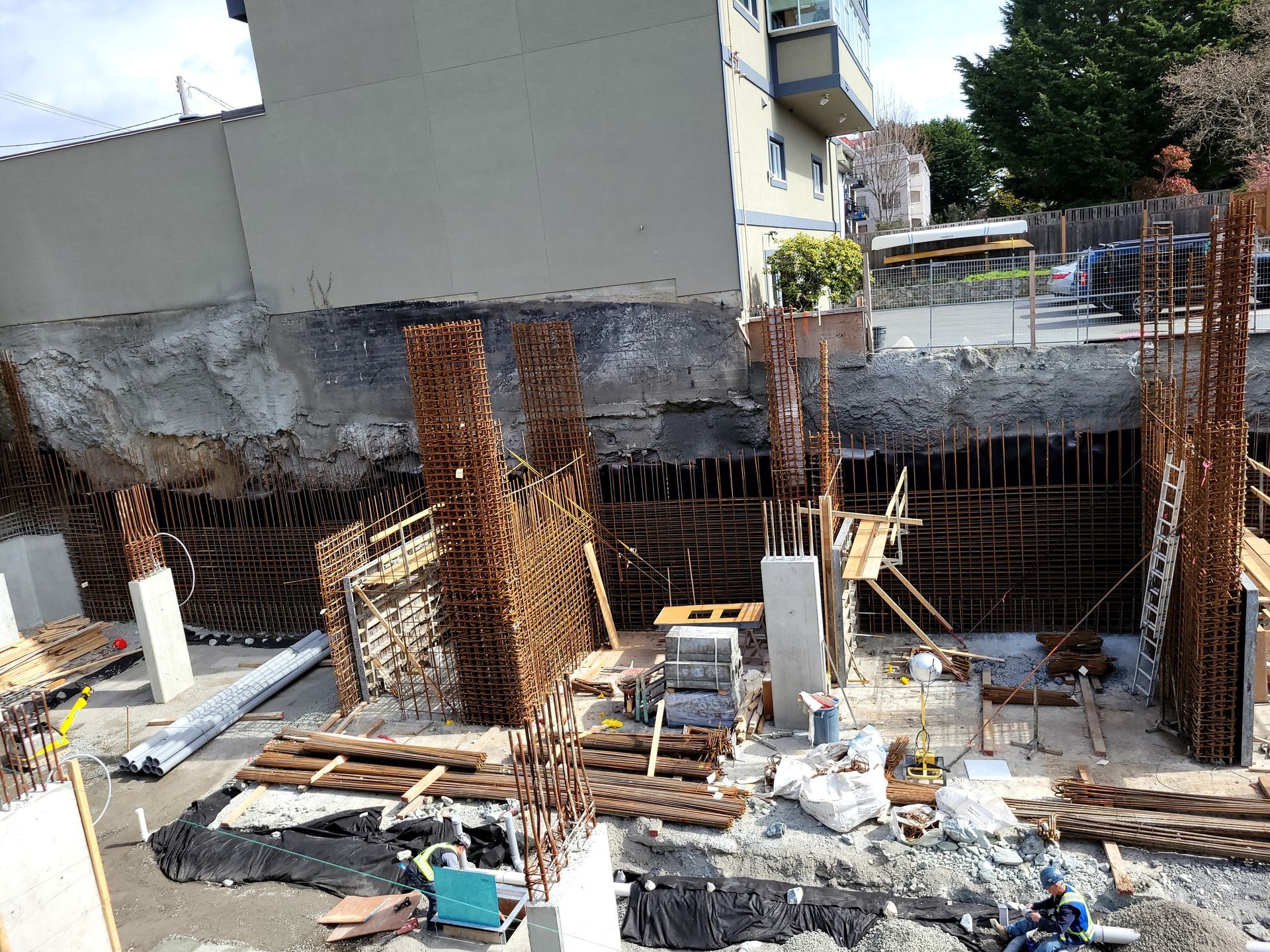 pouring a concrete foundation for a high rise building