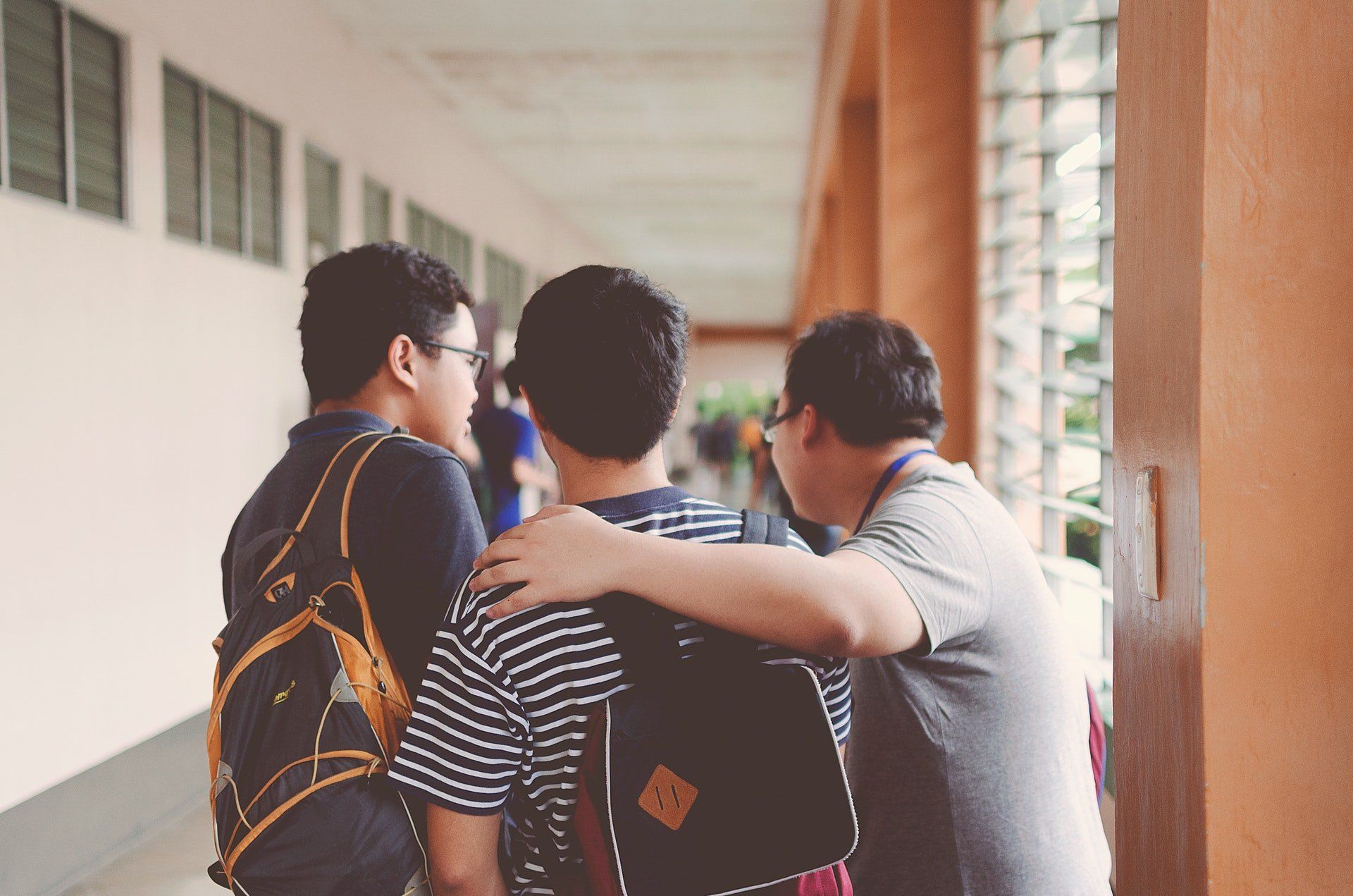 students talking in a school hallway