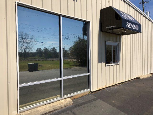 SPF Window Tint installed Storefront — Tinted Glass 69 in Greenville, AL