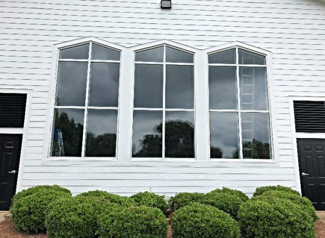Professionally Fast Tinted Glass Montgomery — White House With Tinted Glass Window in Montgomery, AL