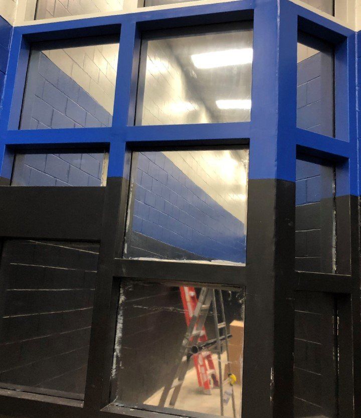 Ladder inside the pod windows is reflecting backin the reflective tint installed to Clanton Jail windows