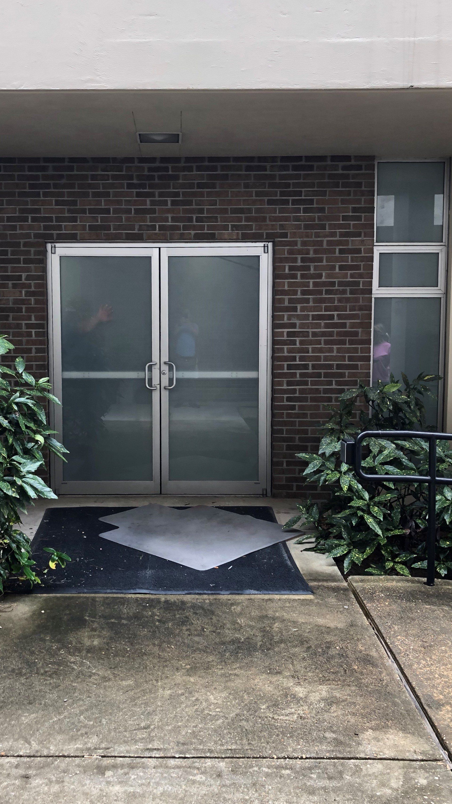 Professional tint installation at Montgomery Business - White Frost Tint installed to glass doors and windows at jail in Montgomery, AL