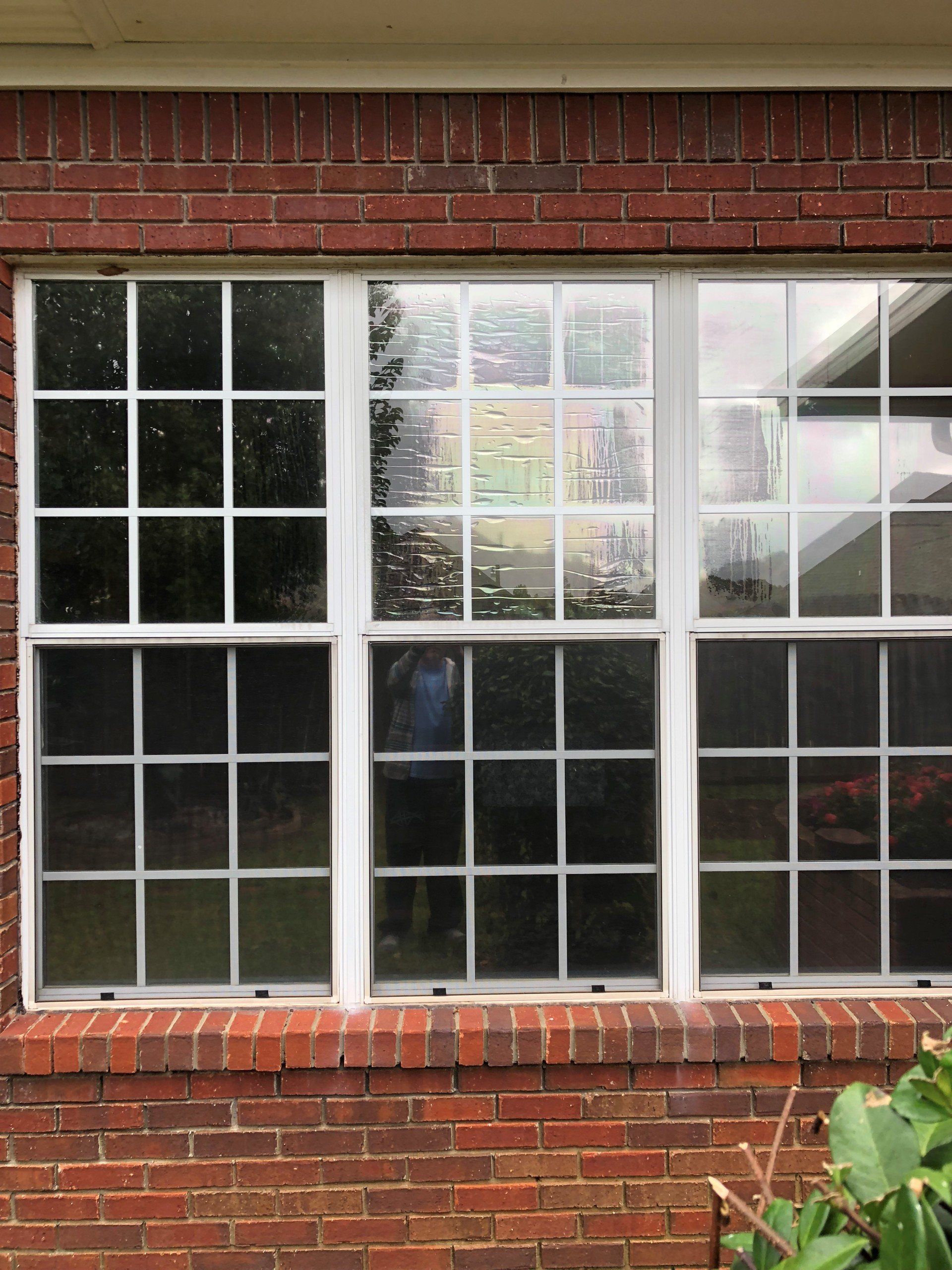 Before the old failing generic tint was removed from Prattville Home windows.