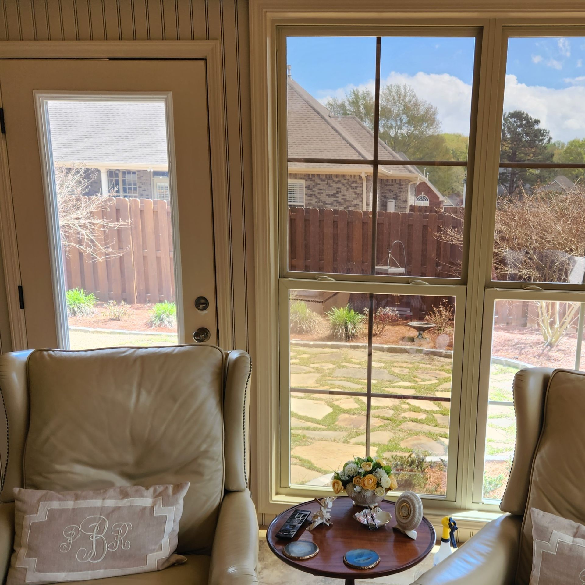 home window tinting - Contrasting Sun Glare seen before last window and glass door are treated with SPF Tint in Prattville AL