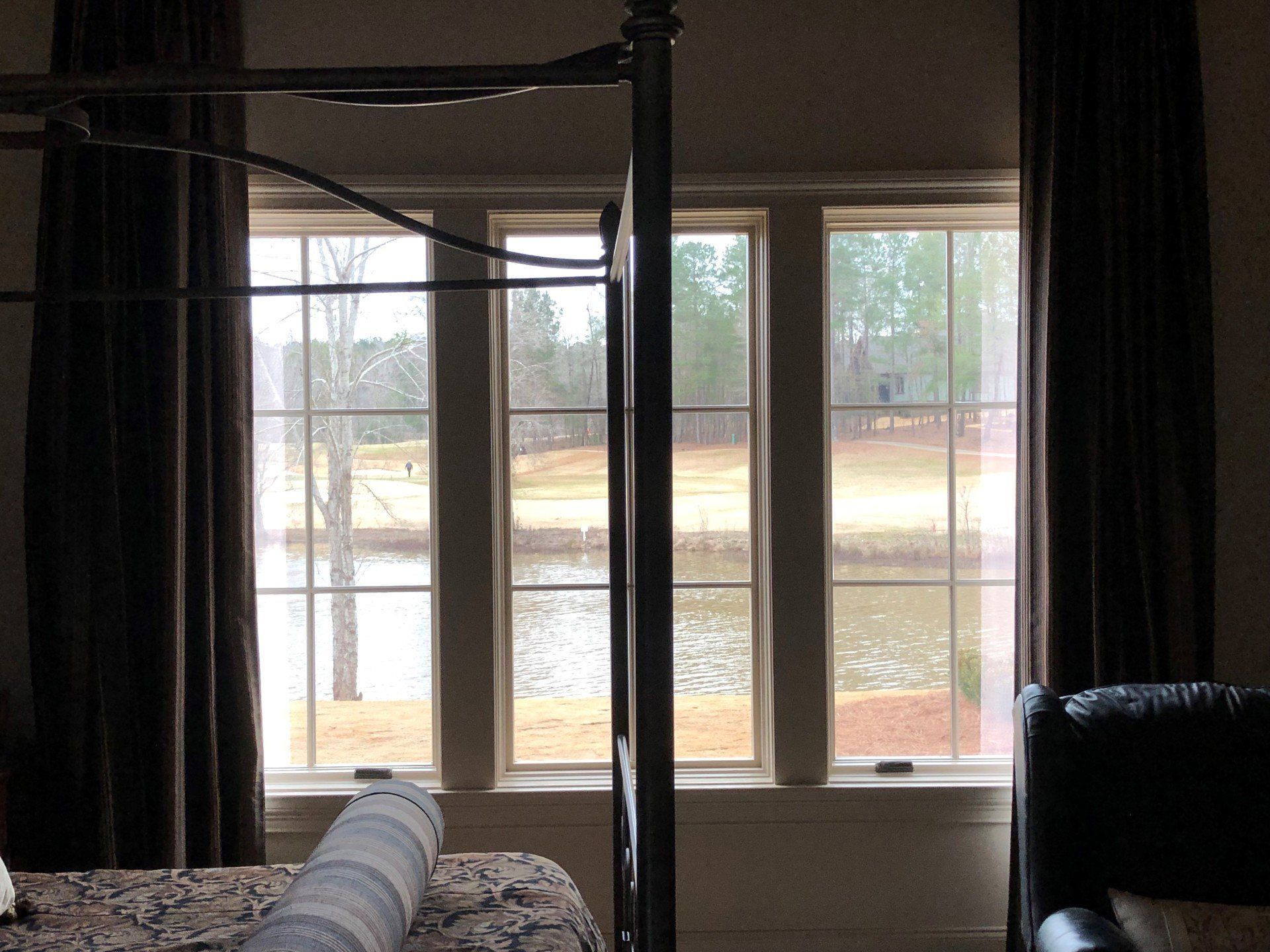 Professionally tinted windows reducing UV glare - home window tint installed on bedroom windows in Auburn, Alabama