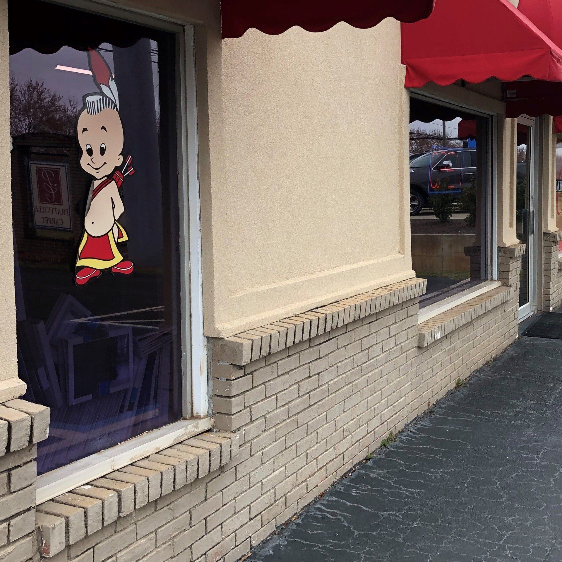 BEFORE Storefront tinted on 1.14.2019 - We removed old generic film before replacing with SPF Quality Tint.