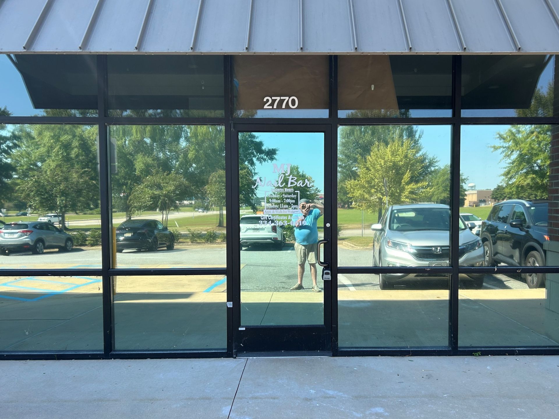 mirror tint installation service Auburn Opelika - Nail Salon storefront windows tinted blocking bright Sun adding one-way viewing inside. Opelika AL