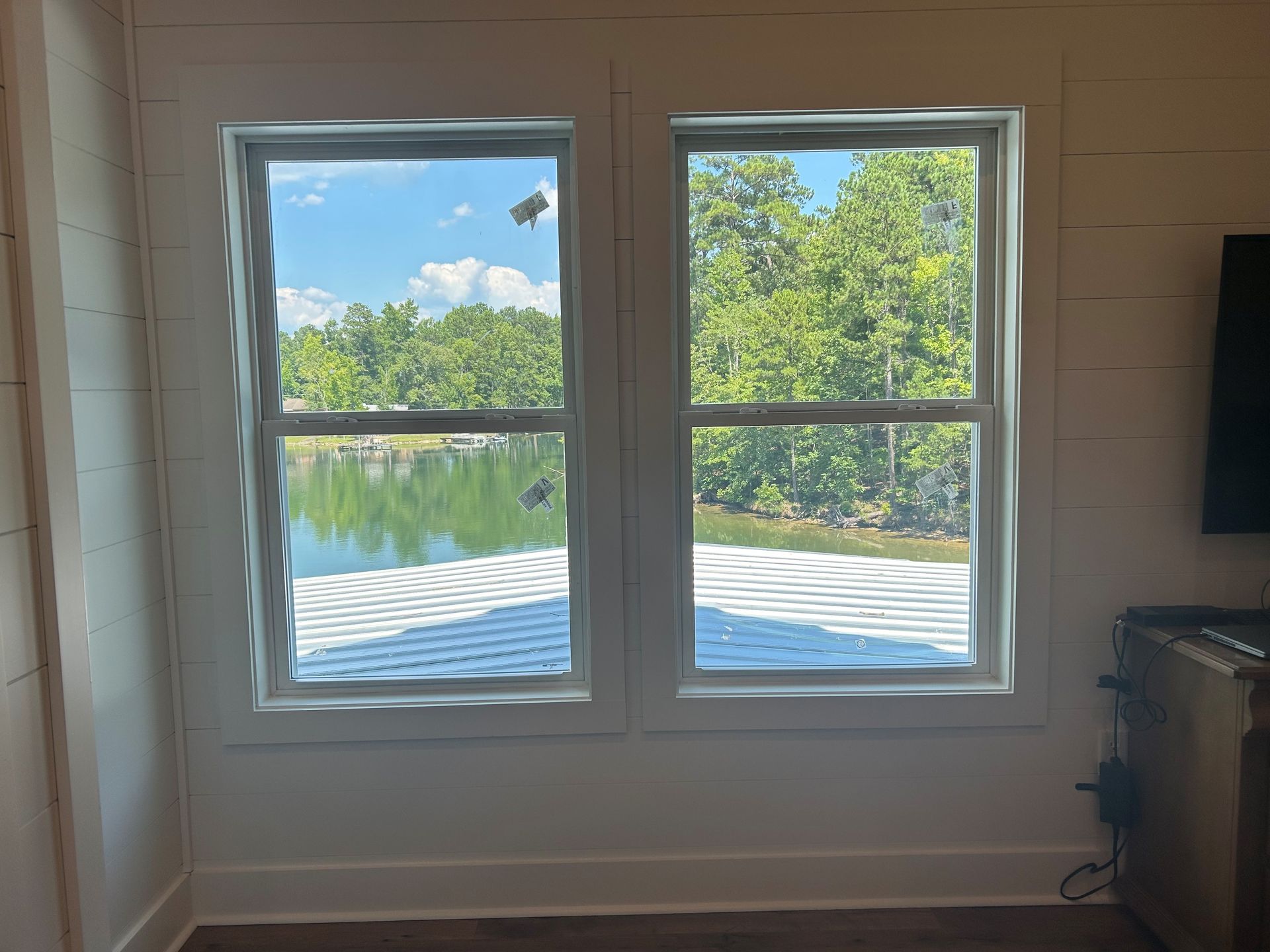 SPF Dimmed Crystal residential window tint adds energy efficiency plus HD-clarity without heat or Sun glare flooding inside the home at Lake Martin. Eclectic, AL