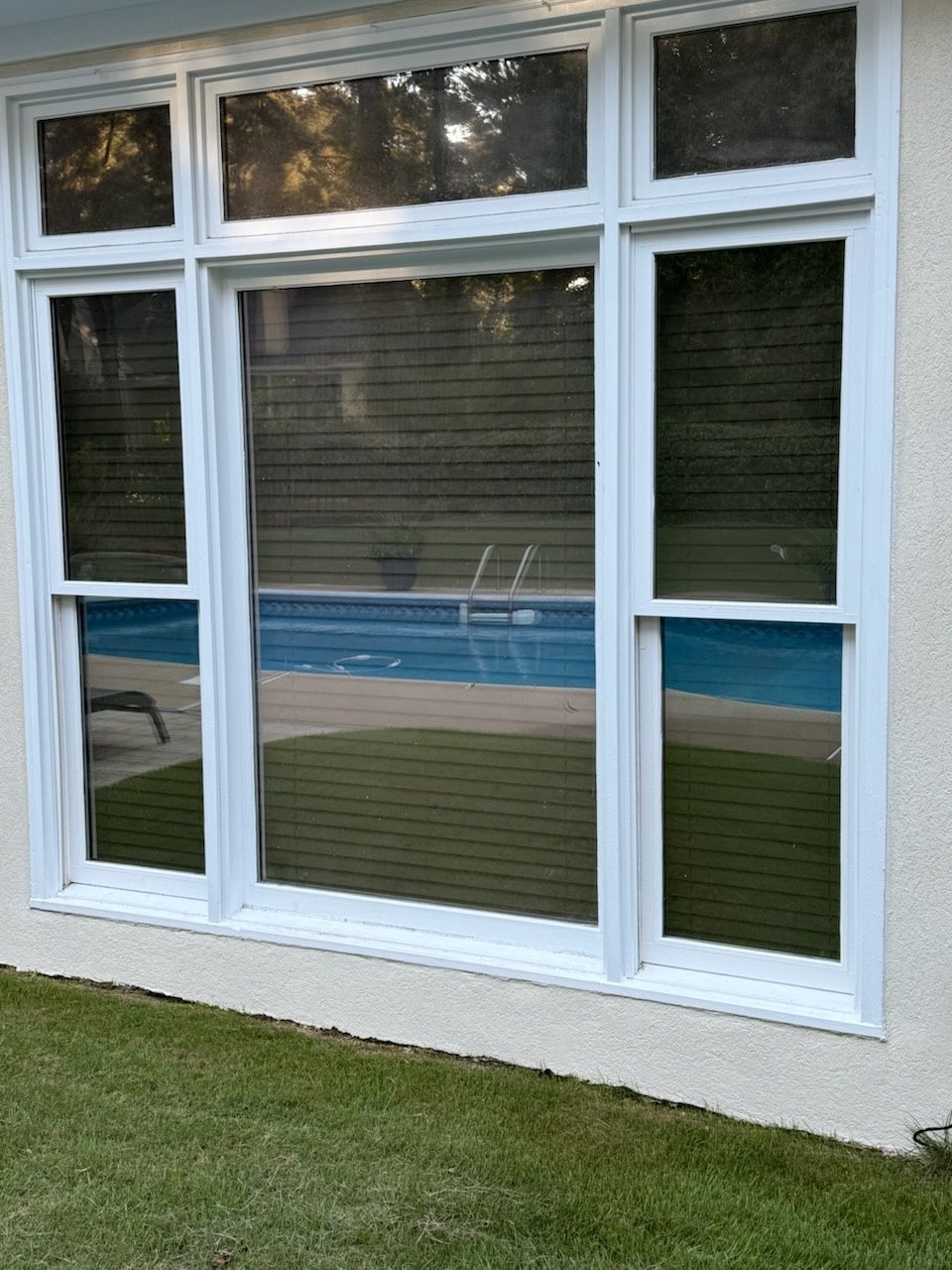 home window tinting - SPF Platinum Tint adds heat rejection with uniform exterior to new low-e panes beside plain window panes. Montgomery AL.