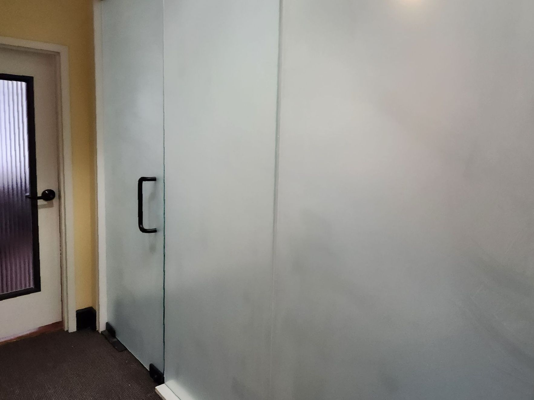 Frosted glass window treatment - SPF Precision Frost tint installed to interior office glass doors and windows adding privacy, style, comfort, and Dust-Free function.