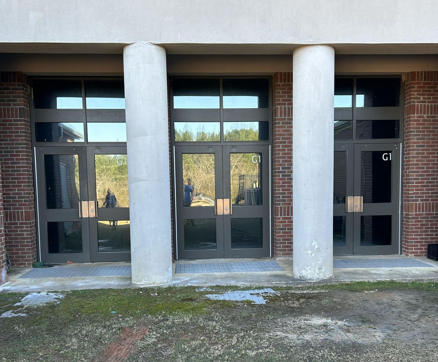 window safety and Sun reducing tint film - Sun glare & heat gain blocked by one-way private SPF Tint adding clarity and comfort inside the school gym. Auburn Opelika AL